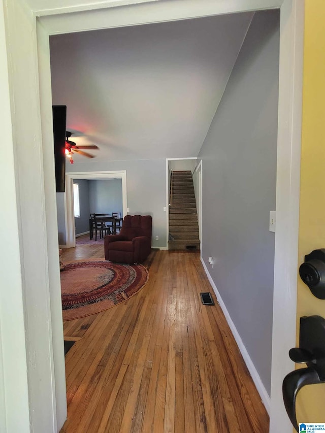 448 Roberts St, Wadley, AL 36276 - hall with hardwood / wood-style floors, stairs, and baseboards
