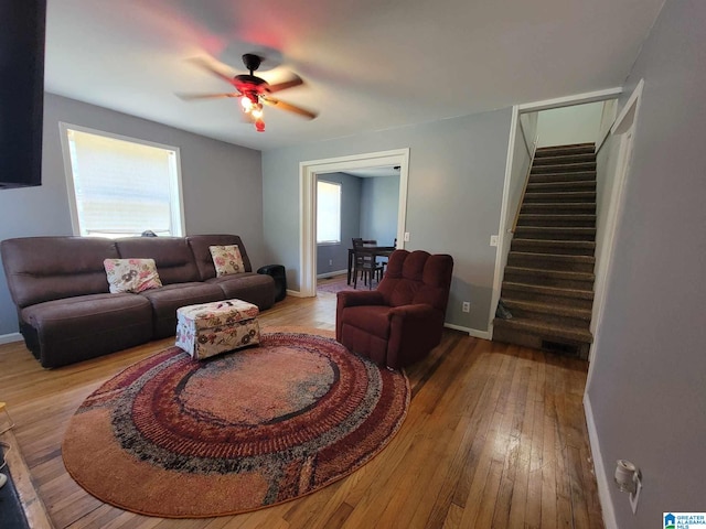 living room with ceiling fan, a healthy amount of sunlight, and wood-type flooring