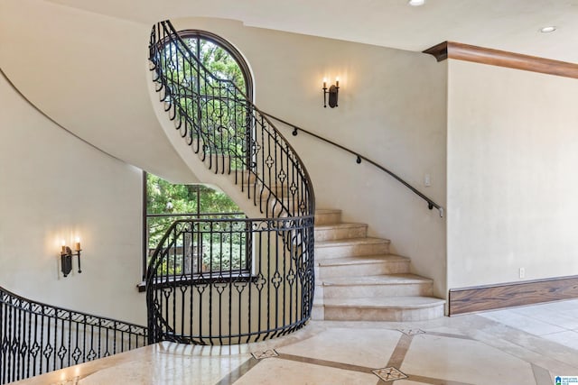 stairs with tile patterned floors