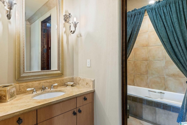 bathroom featuring vanity and tiled shower / bath combo