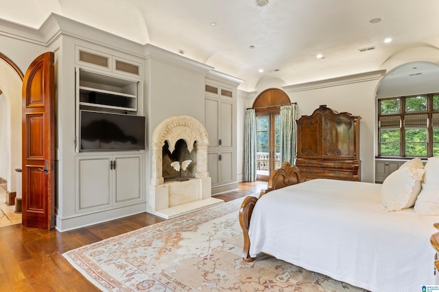 bedroom with hardwood / wood-style floors