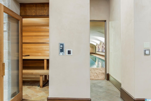 hall with light tile patterned flooring