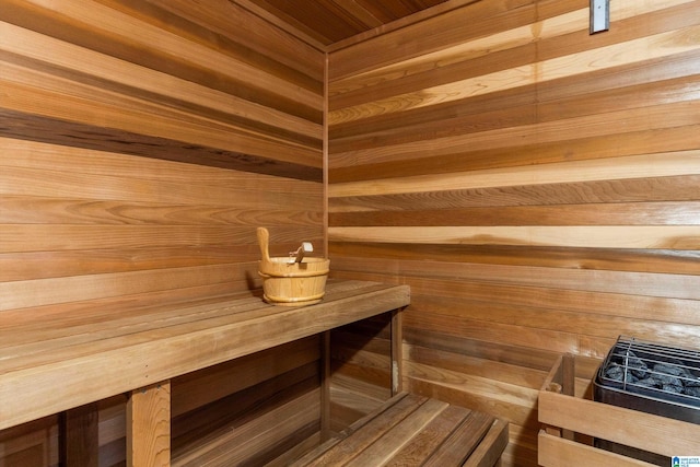 view of sauna / steam room featuring wood walls