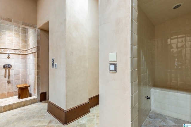 bathroom with a tile shower