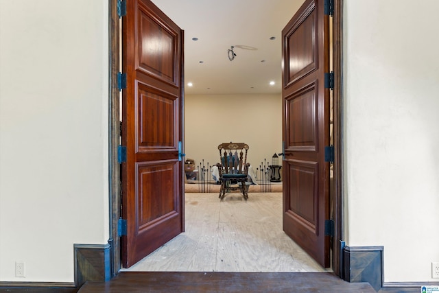 hall with light hardwood / wood-style flooring