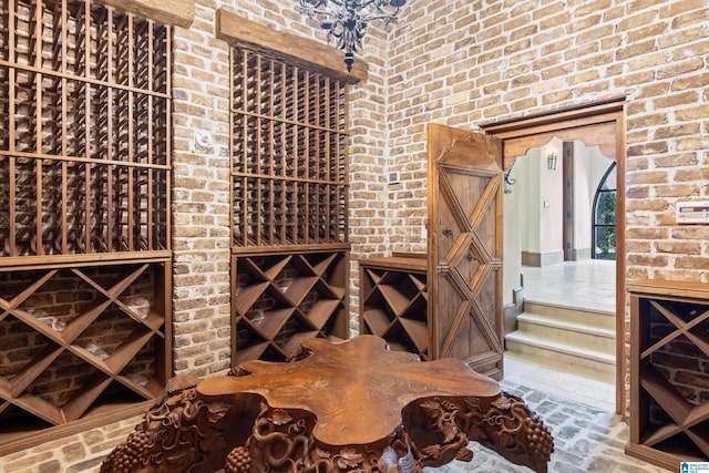 wine area featuring brick wall