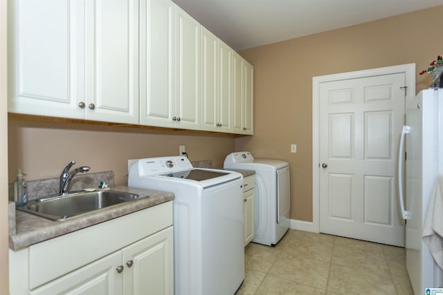 171 Sheeps Xing, Calera, AL 35040 - laundry room featuring light tile patterned floors, a sink, baseboards, cabinet space, and washing machine and clothes dryer
