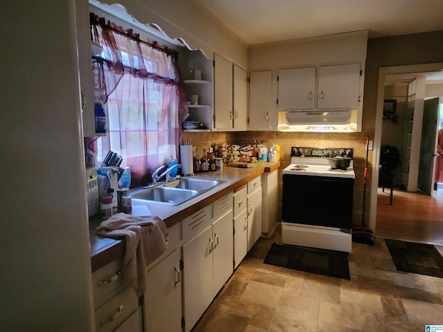 kitchen with sink, white cabinets, white electric stove, and decorative backsplash