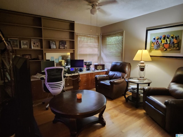 office space with ceiling fan and light hardwood / wood-style flooring