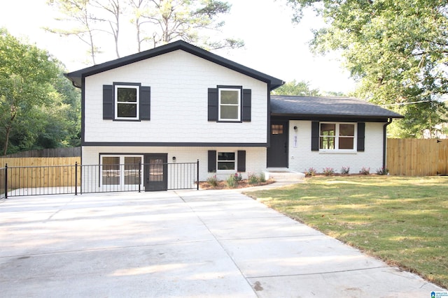 split level home with a front yard