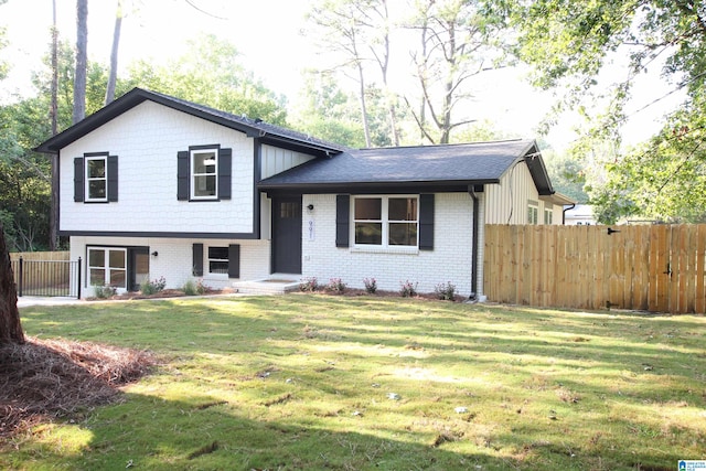 split level home with a front yard