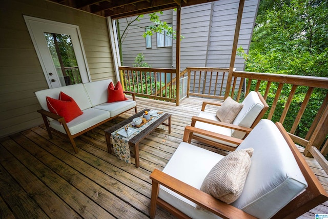 wooden deck with an outdoor hangout area