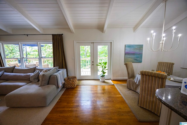 living room with a chandelier, french doors, beam ceiling, and hardwood / wood-style flooring