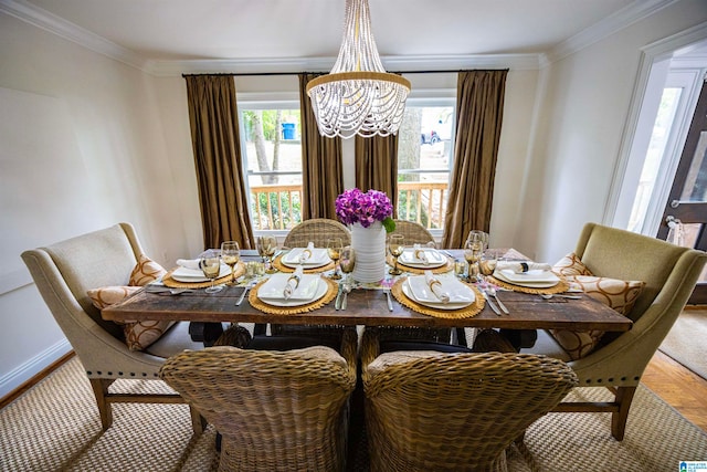 dining area featuring ornamental molding, hardwood / wood-style floors, and a notable chandelier