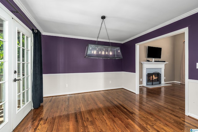 interior space with french doors, crown molding, and hardwood / wood-style floors