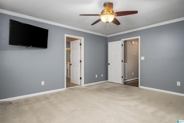 unfurnished bedroom with ceiling fan, crown molding, and carpet flooring