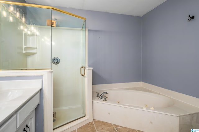 bathroom with separate shower and tub, vanity, and tile patterned floors