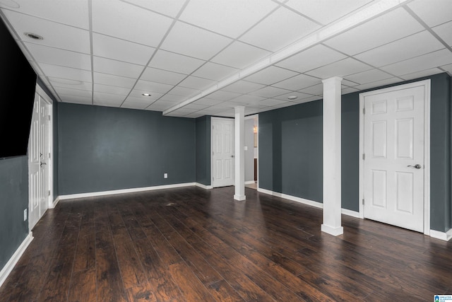 basement featuring a paneled ceiling and wood-type flooring