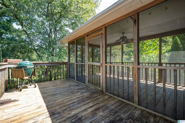 deck with a sunroom