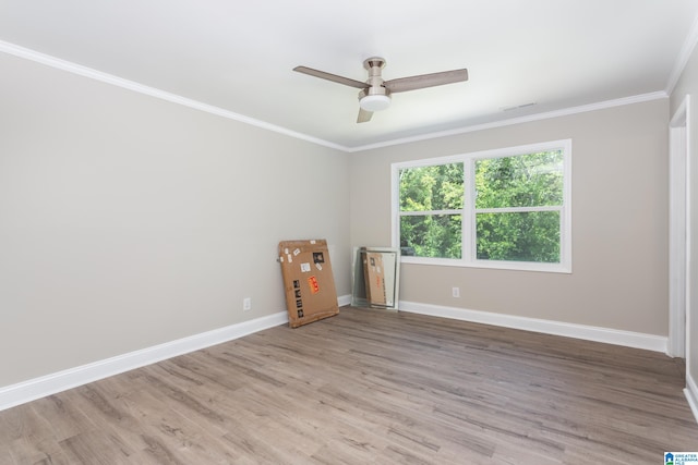 unfurnished room with hardwood / wood-style floors, crown molding, and ceiling fan