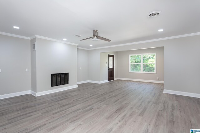 unfurnished living room featuring ceiling fan, light hardwood / wood-style flooring, and ornamental molding