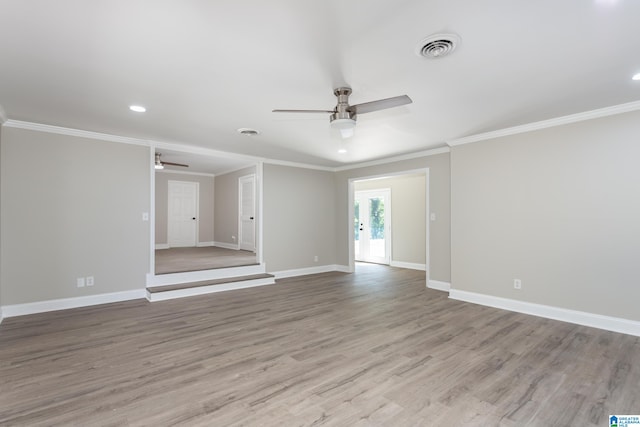 spare room featuring ceiling fan, light hardwood / wood-style floors, and ornamental molding