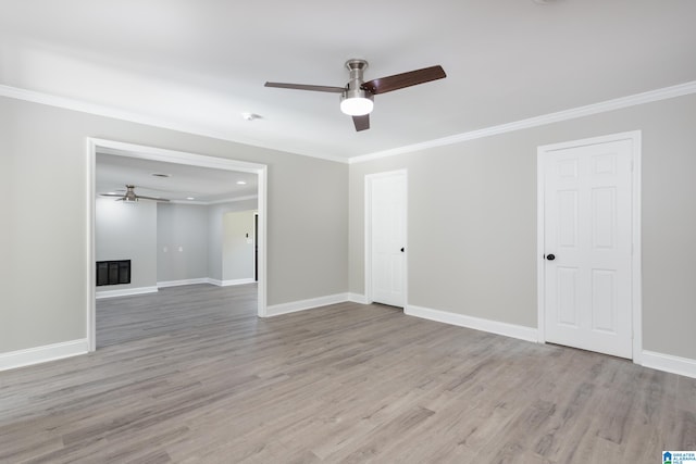 empty room featuring ceiling fan, hardwood / wood-style floors, and ornamental molding