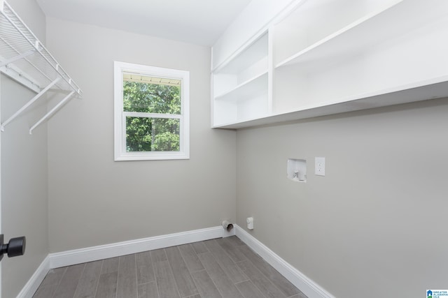 laundry room featuring washer hookup and hardwood / wood-style flooring