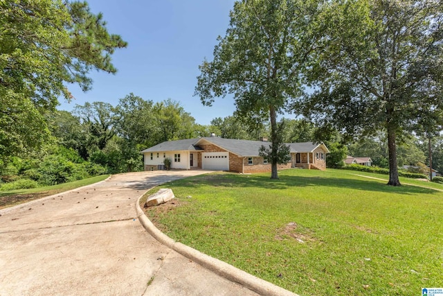 single story home with a garage and a front yard