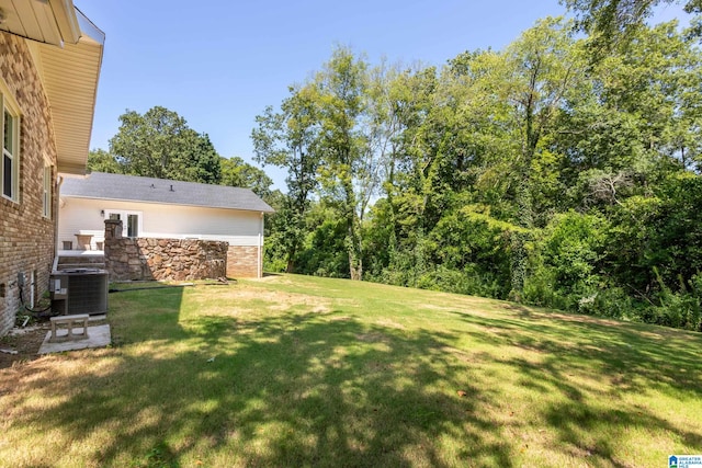 view of yard featuring central AC