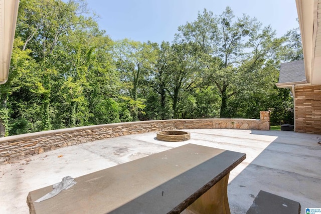 view of patio / terrace with an outdoor fire pit