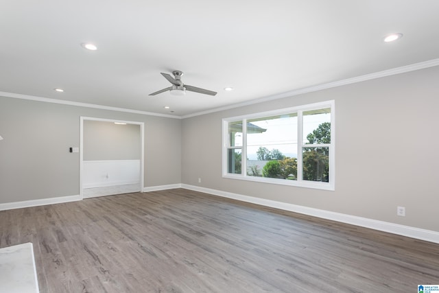 unfurnished room with ceiling fan, hardwood / wood-style floors, and crown molding