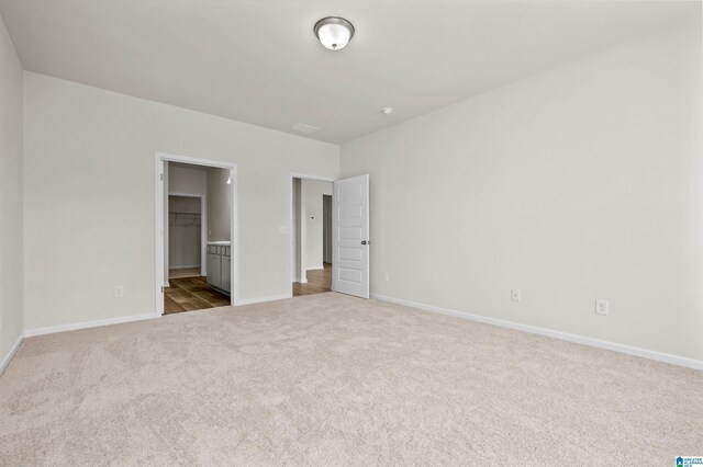 laundry room featuring washing machine and clothes dryer and light colored carpet