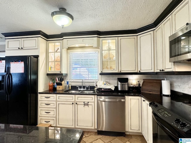 kitchen featuring light tile patterned floors, sink, a textured ceiling, and black appliances