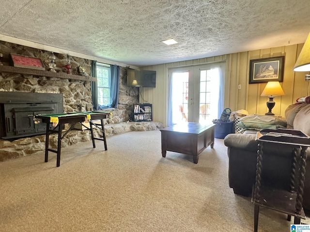 living room with a fireplace, carpet floors, and plenty of natural light