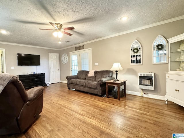 living room featuring light hardwood / wood-style floors, crown molding, and a textured ceiling