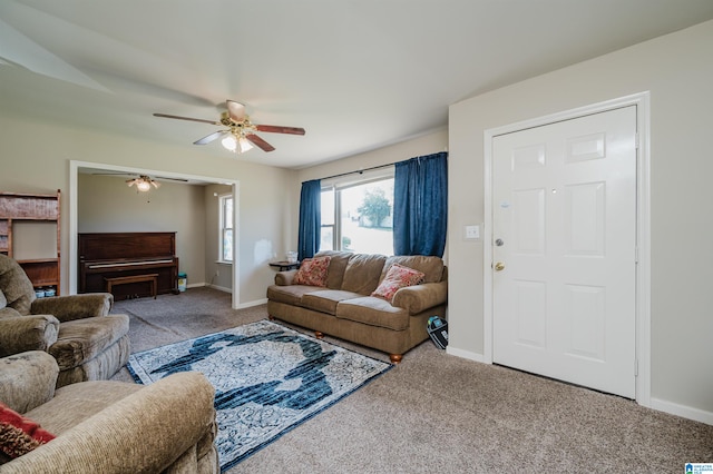 carpeted living room featuring ceiling fan