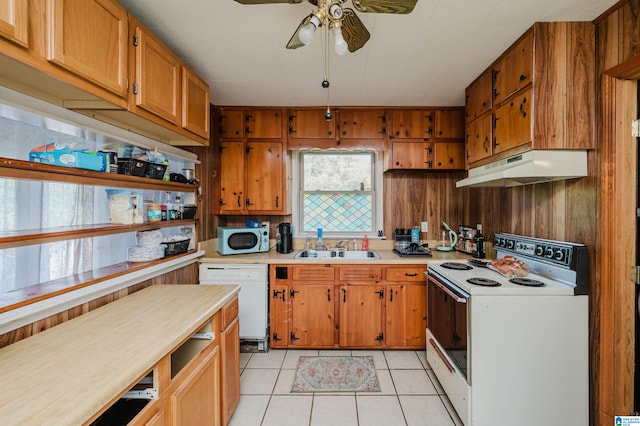 kitchen featuring ceiling fan, light tile patterned floors, sink, and white appliances