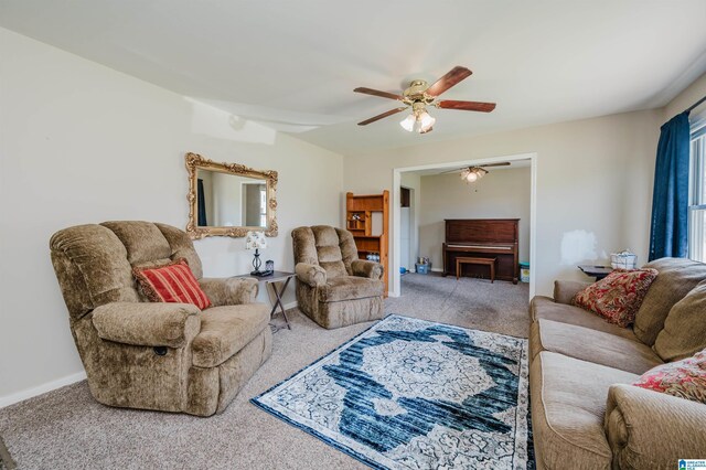 carpeted living room featuring ceiling fan and a healthy amount of sunlight