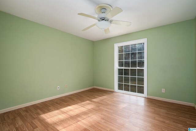 spare room featuring ceiling fan and light colored carpet