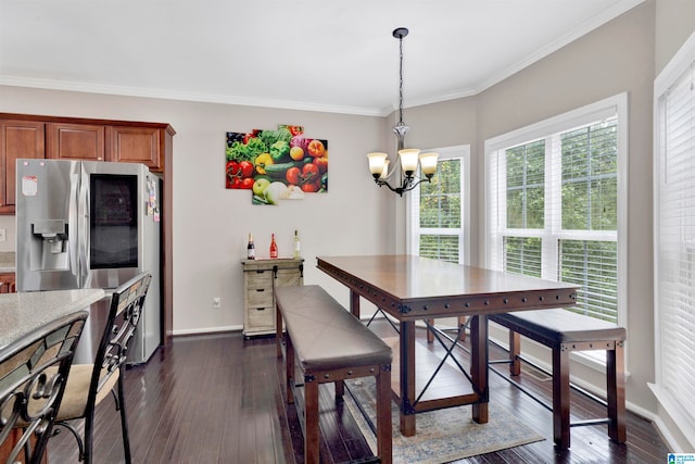 dining room with baseboards, a chandelier, dark wood finished floors, and crown molding