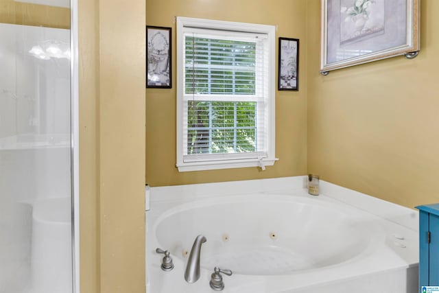 full bath featuring a tub with jets