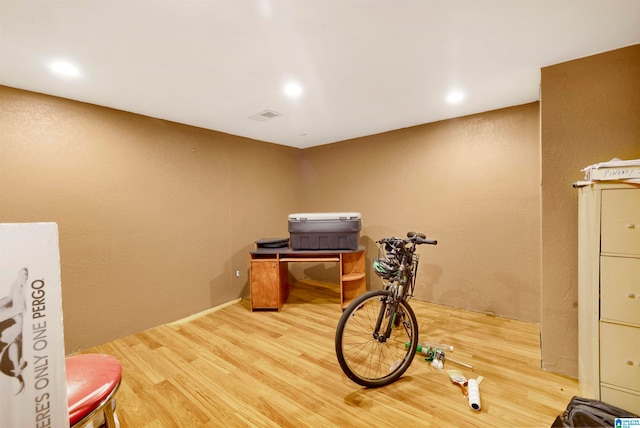 interior space featuring visible vents and wood finished floors