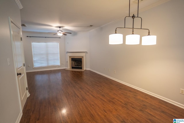 unfurnished living room featuring dark hardwood / wood-style flooring, crown molding, and a high end fireplace