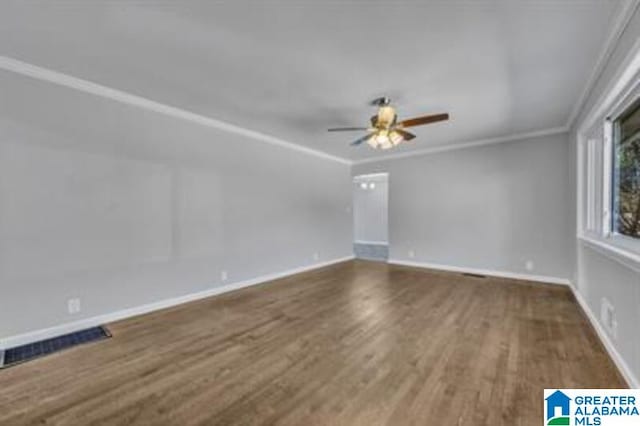 unfurnished room featuring ceiling fan, ornamental molding, and wood-type flooring