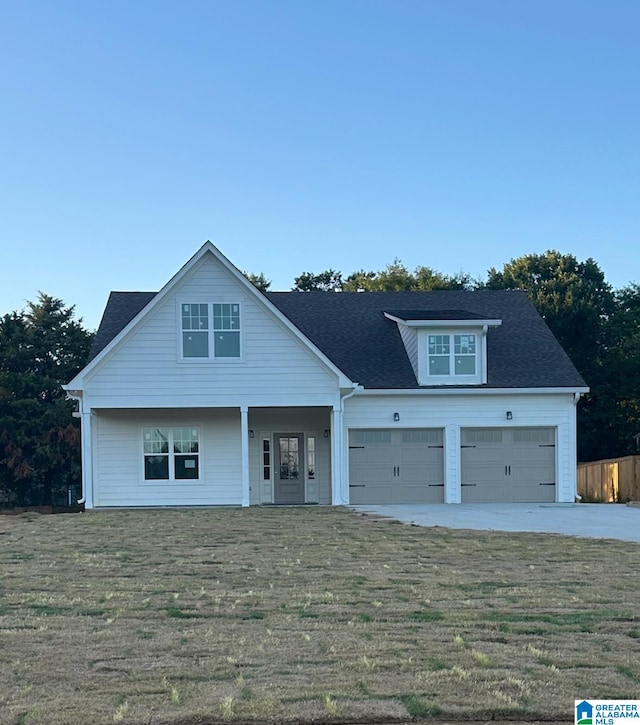 view of front facade with a front lawn and a garage