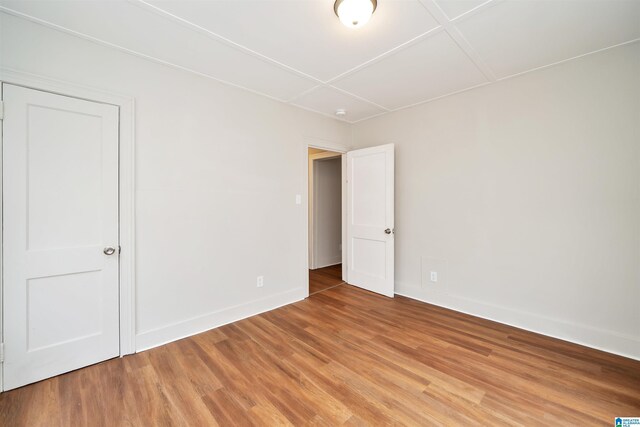 spare room with hardwood / wood-style floors