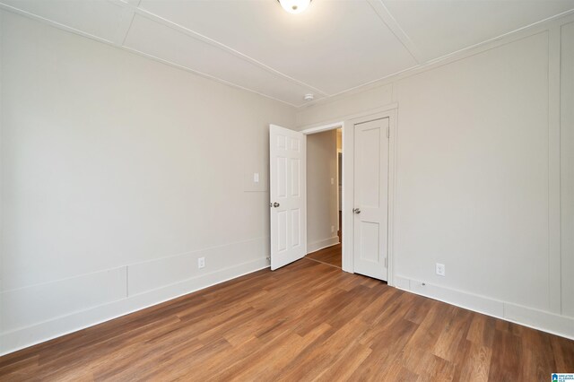 empty room with wood-type flooring