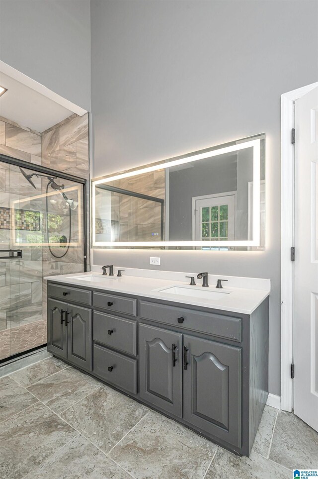 bathroom featuring high vaulted ceiling, a skylight, tiled tub, and tile patterned floors