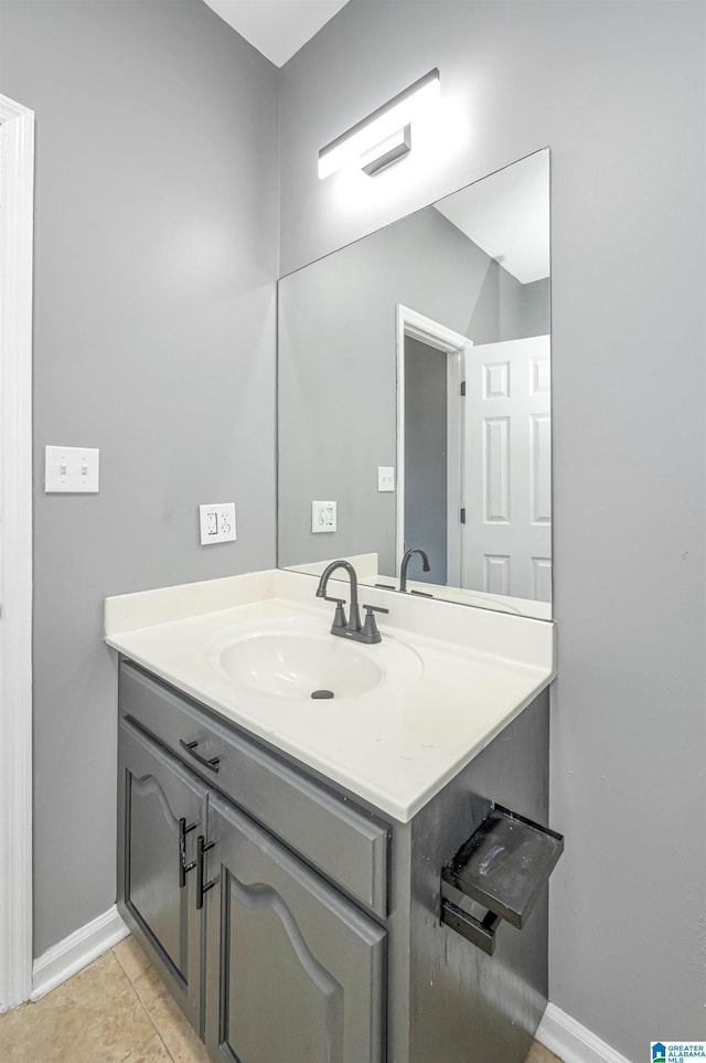 bathroom with tile patterned flooring and vanity